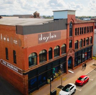 Dayle's Grand Market, Amherst. Large sandstone building with many windows.