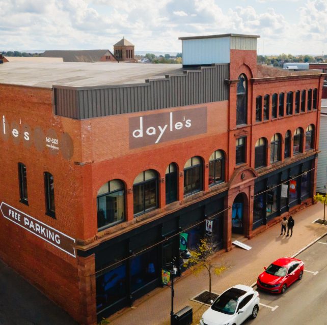 Dayle's Grand Market, Amherst. Large sandstone building with many windows.